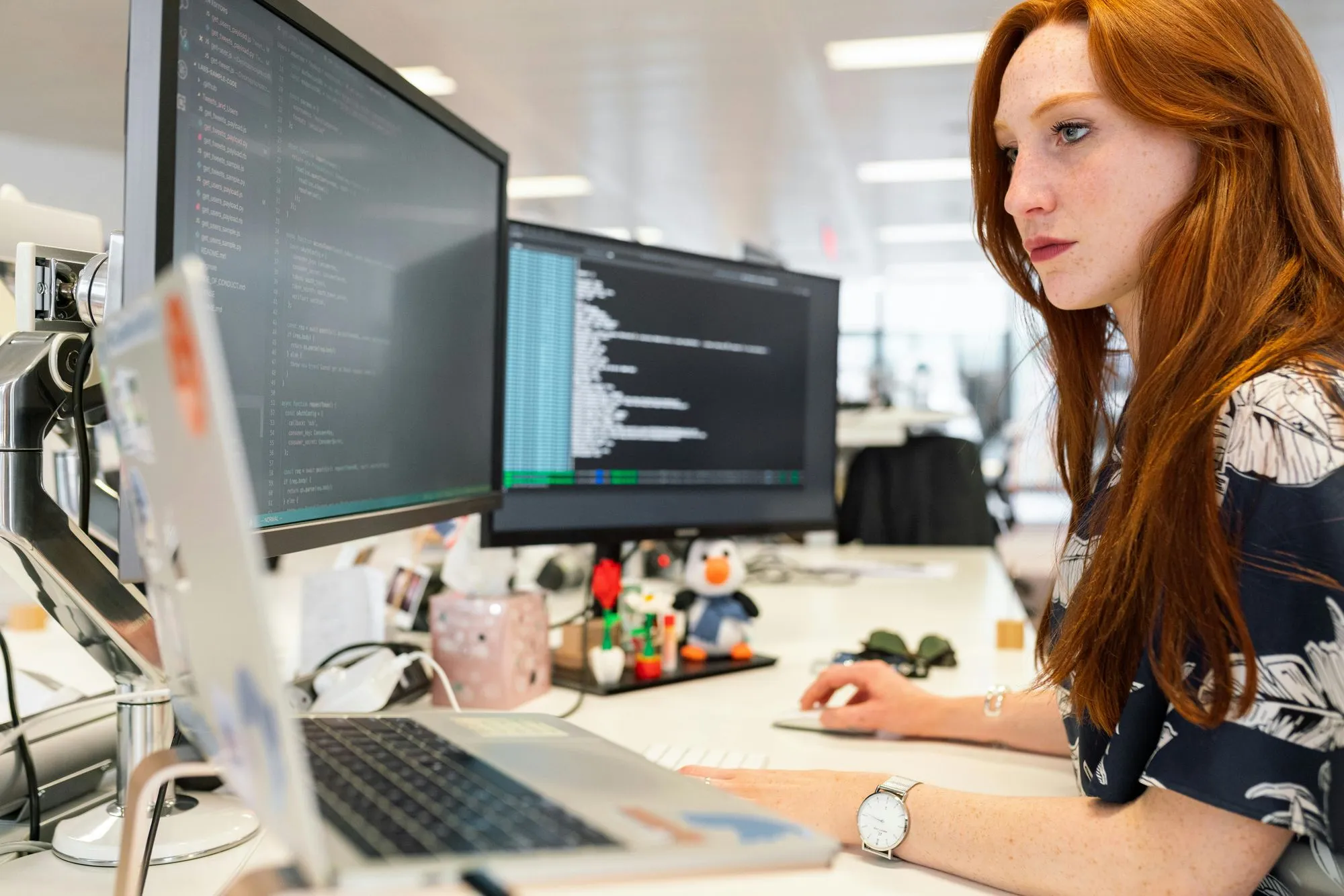 A member of the Neural Soft team working at a computer